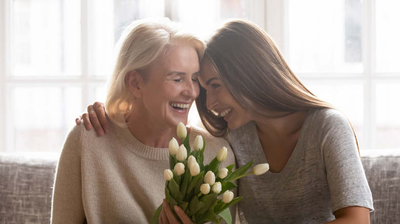 mother and daughter smiling