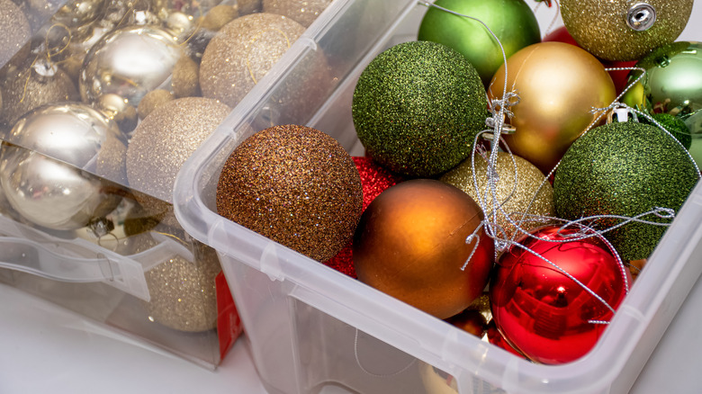 holiday ornaments in clear bins