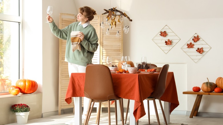 woman decorating home for fall