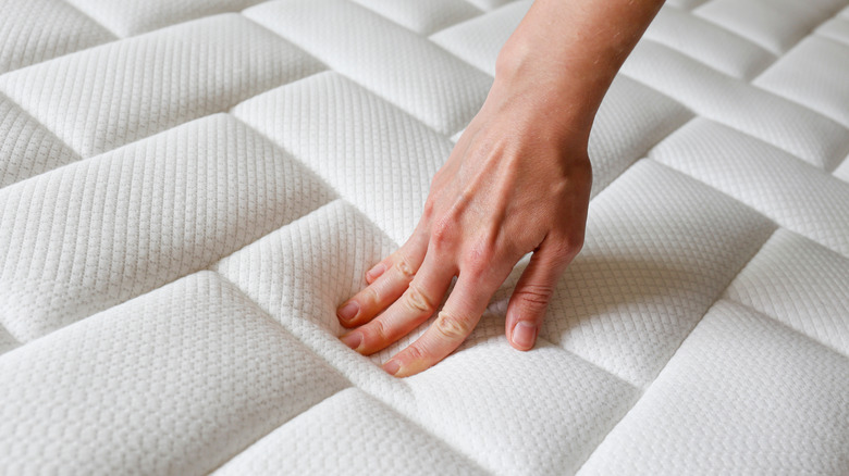 hand testing foam mattress