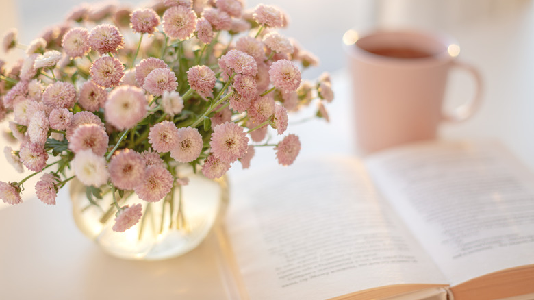 pink flower bouquet and book