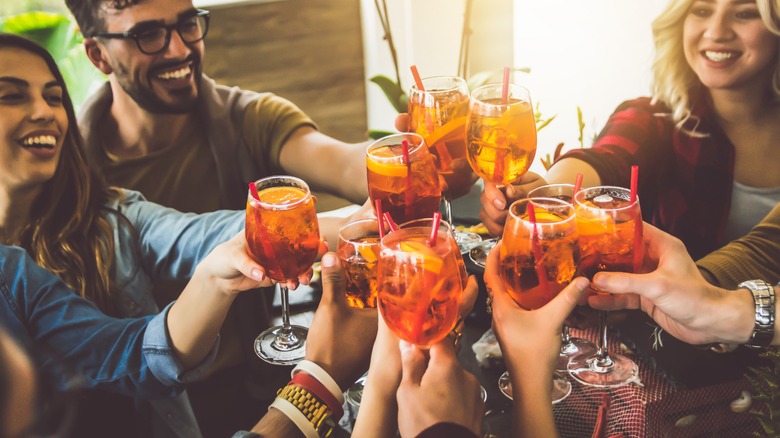 friends toasting with cocktails 