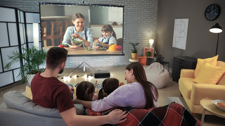 family enjoying movie together