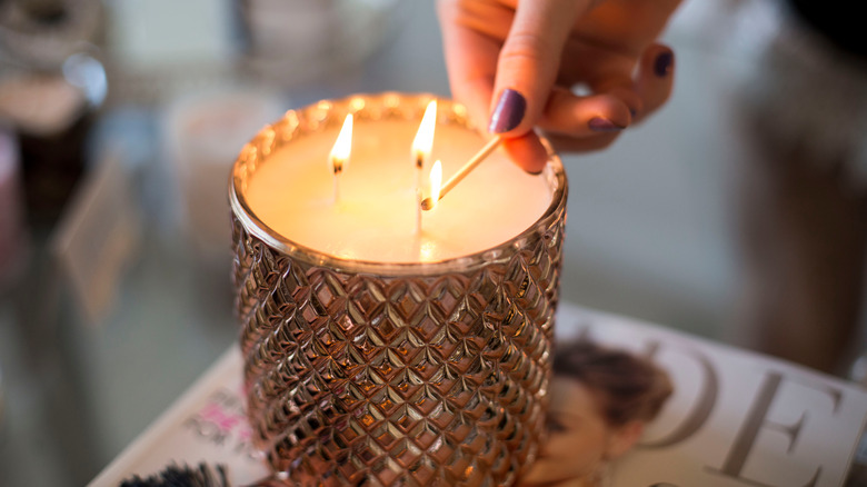 Hand Lighting a crystal candle
