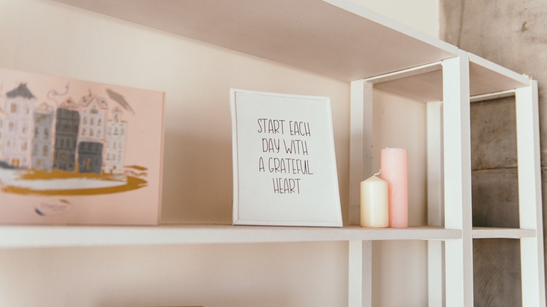 white metal bookcase in bedroom