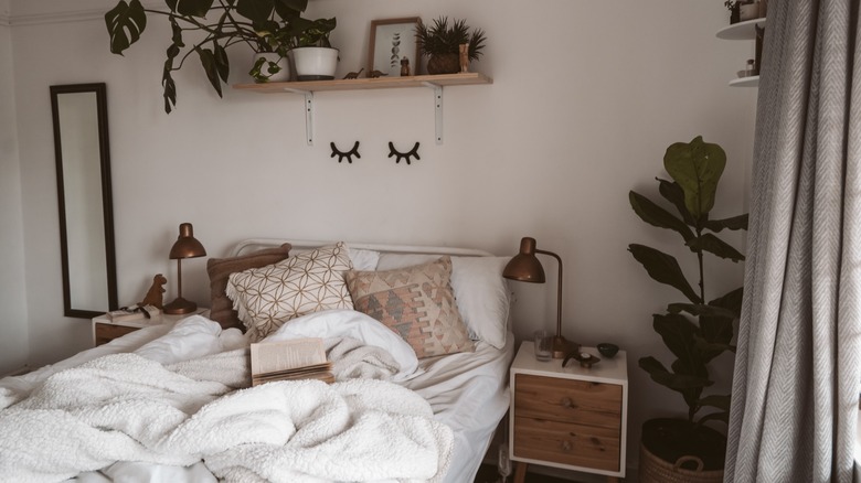 white Scandinavian bedroom with plants