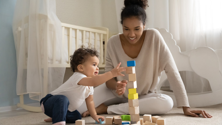 mom and baby playing with blocks