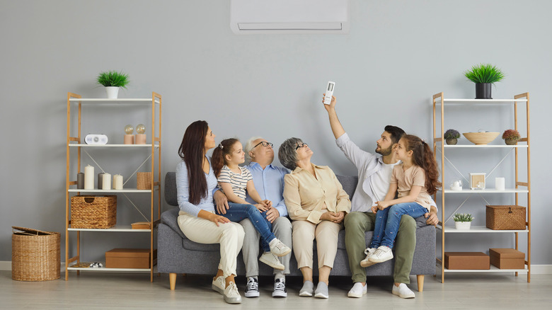 family enjoying AC unit