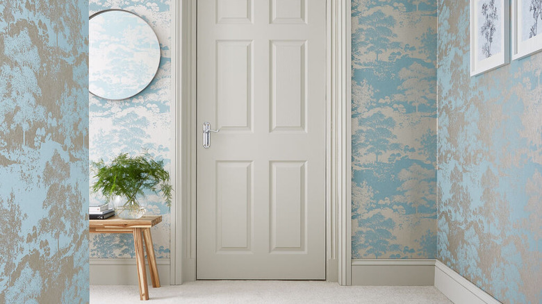 hallway with patterned wallpaper