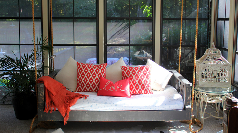 bench with red and white pillows