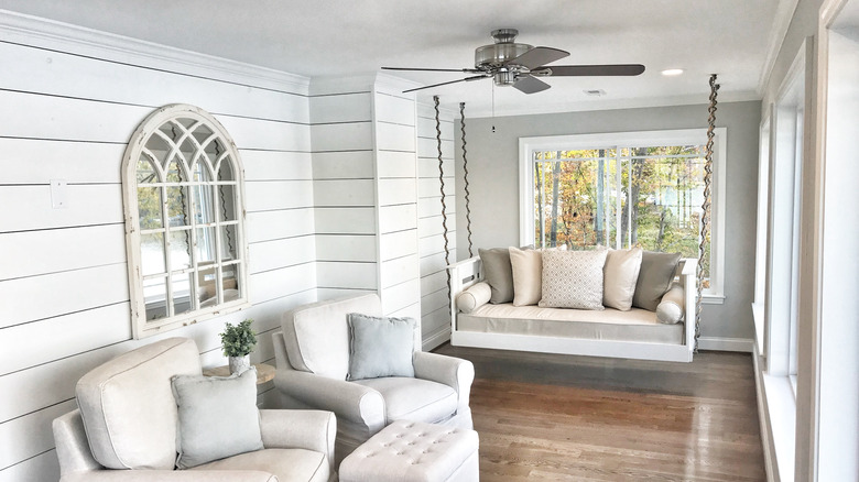 white porch swing and chairs