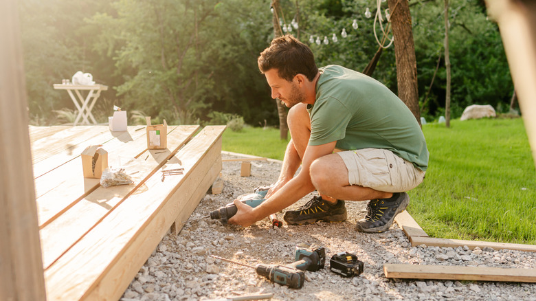 man fixing a deck