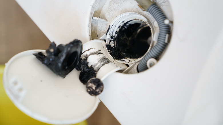 Close up of clogged washing machine filter