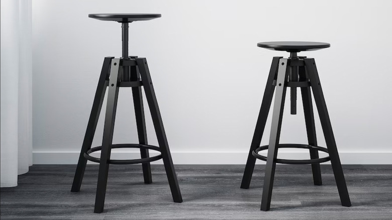 two backless black adjustable stools