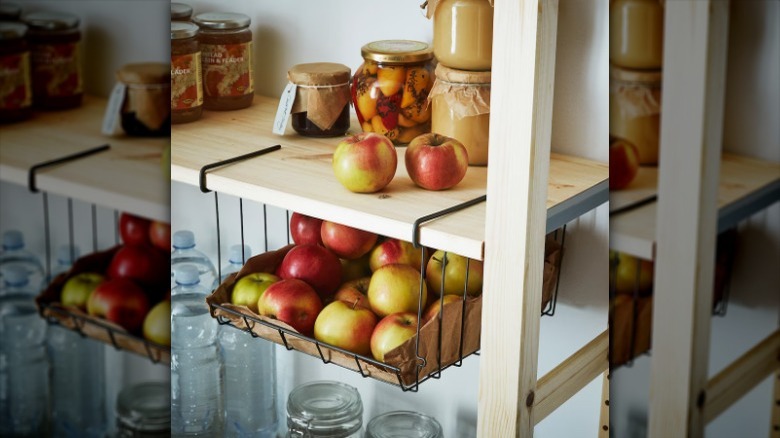 apples in hanging wire basket