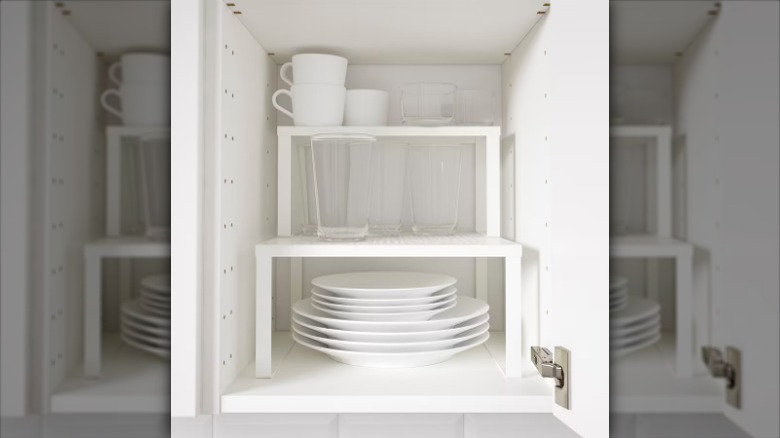 white and glass drinkware on shelf