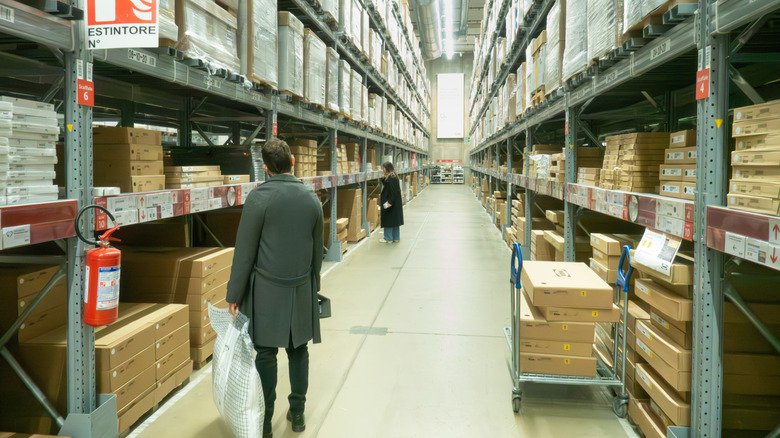 Customers shopping in an IKEA warehouse