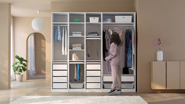 woman with IKEA pax wardrobe