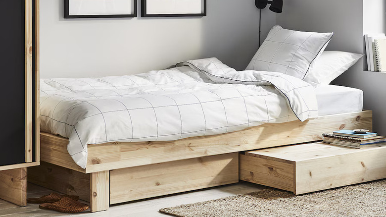 IKEA's GLAMBERGET bed with table extended.