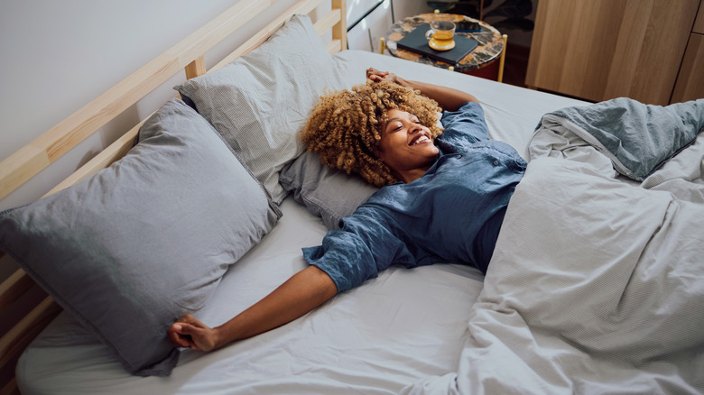 person sleeping in sheets