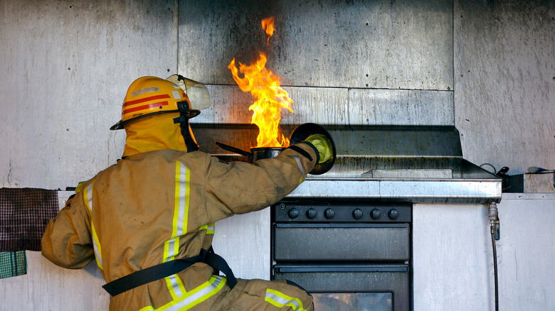 fire fighter near burned stove
