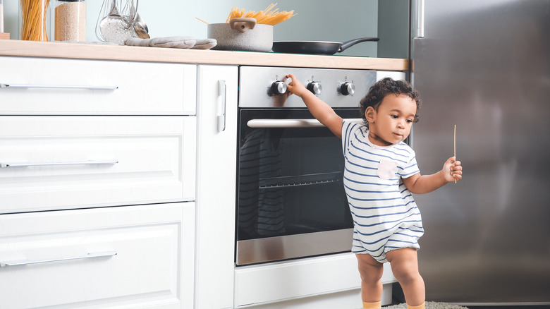 baby boy near oven