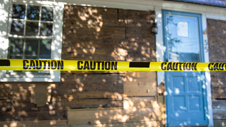 House with crime scene tape