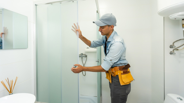 Professional attaching shower door 