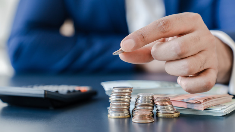 Man stacking coins