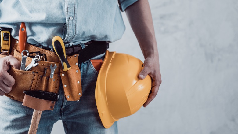 Man holding safety helmet