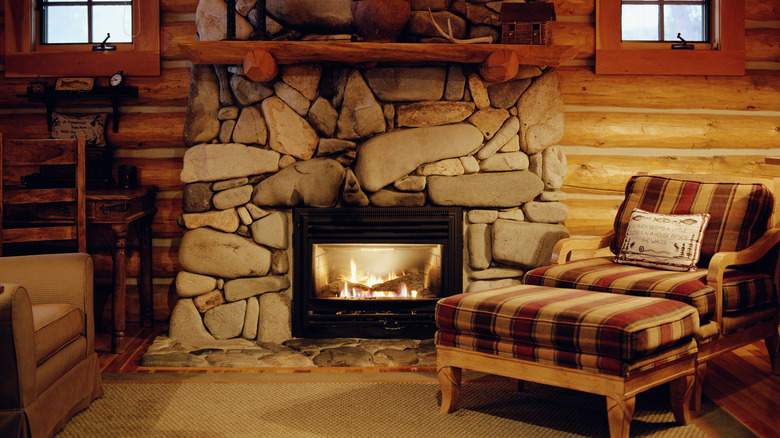 stone fire place and old chair 