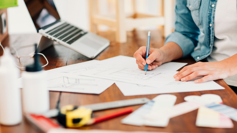 Person sketching furniture design