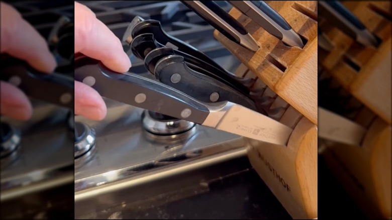 Ina Garten putting knives away