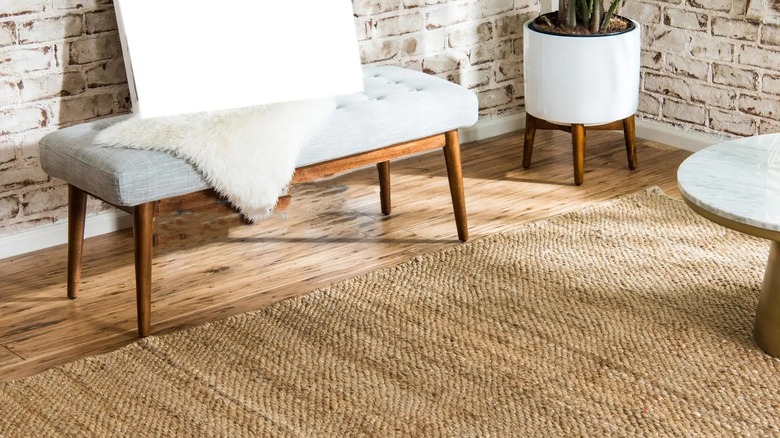 jute rug in brick room