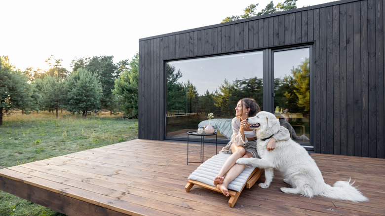 woman and dog on modern deck