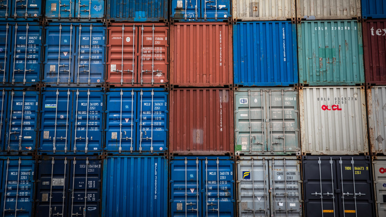 stacked multicolored shipping containers