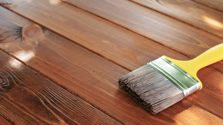 wood deck installation with brush