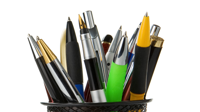 several pens in a holder