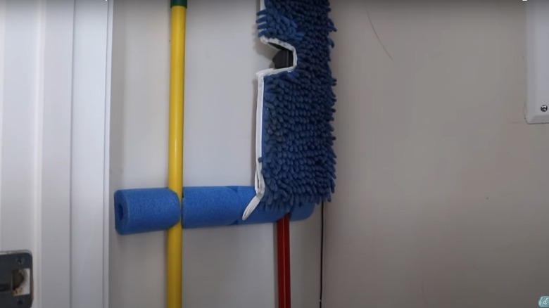 pool noodle broom holder