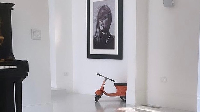 Orange tricycle in a room