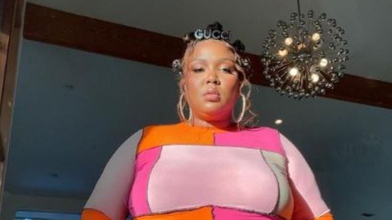 Lizzo with sputnik chandelier 