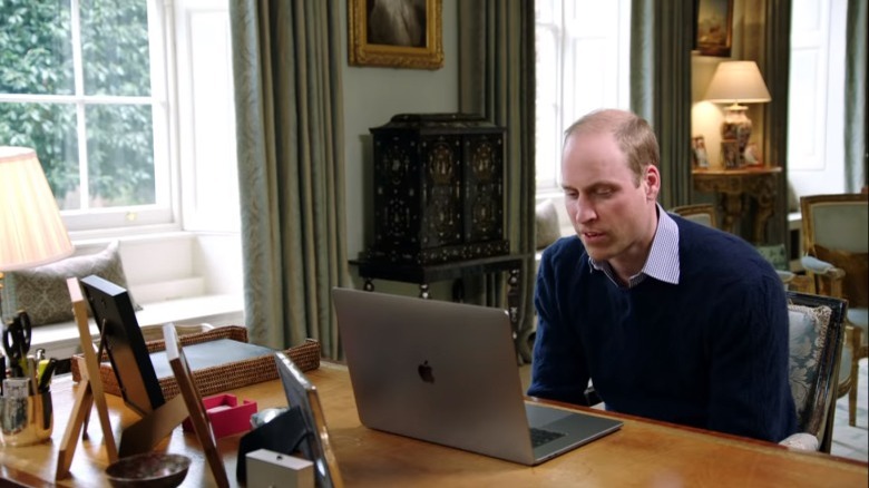 Prince William at a desk