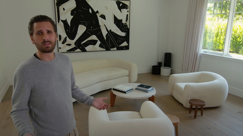 Scott Disick showing designer furniture