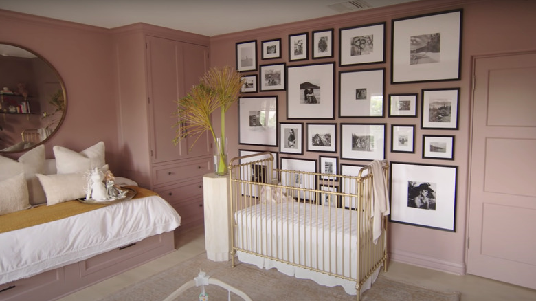 photo wall in pink nursery