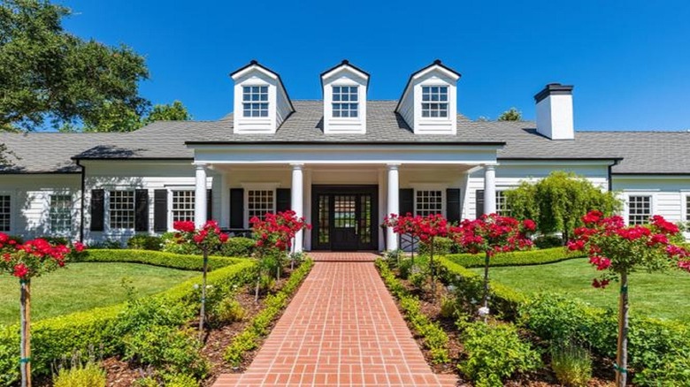 front view of large house with manicured lawns