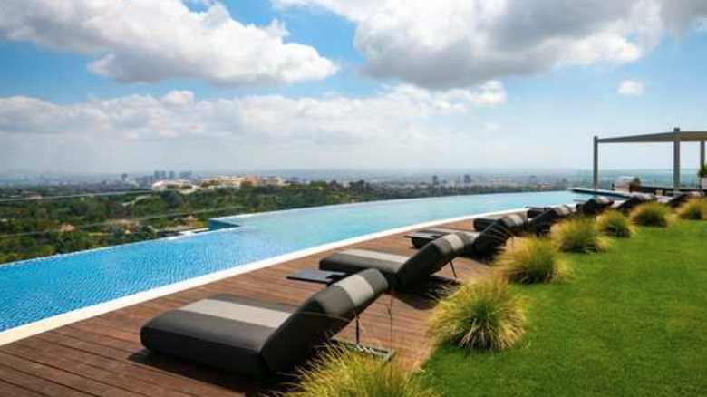 infinity swimming pool with lounge chairs