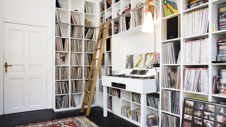 rolling ladder attached to shelves