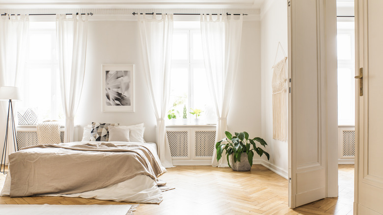 bedroom with sheer curtains