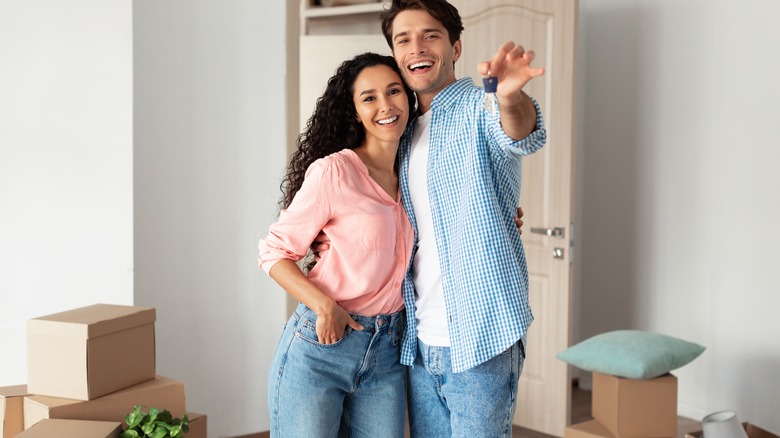 Couple standing in new home