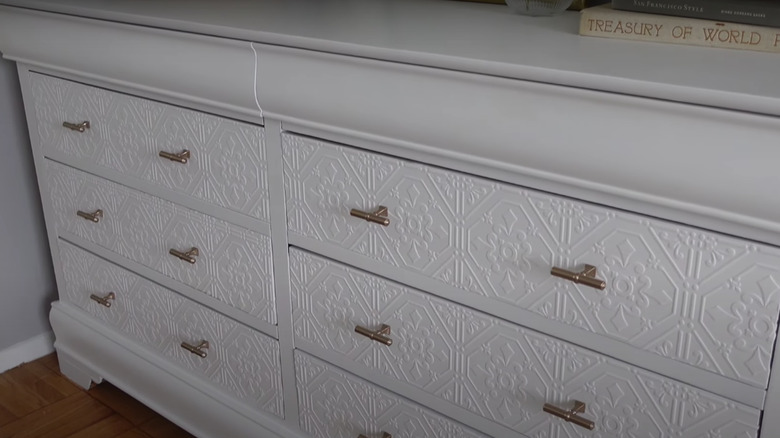 Dresser with wallpaper decoration